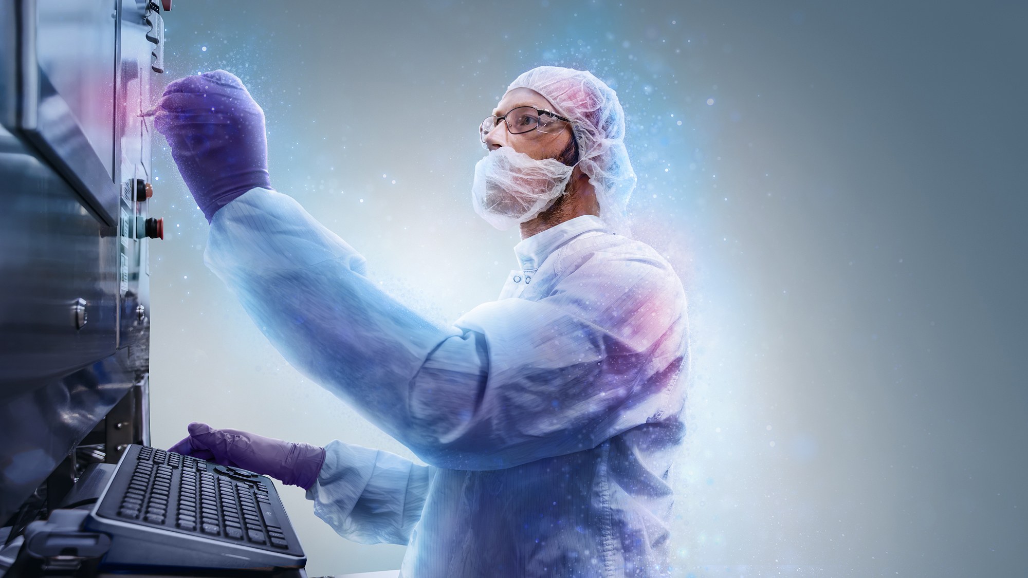 Technician in cleanroom garments operating GMP manufacturing equipment, composited against a graded background